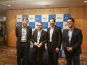 Comunet receiving the most innovative partner of the year award with Stefan Jansen, Terry Wise and Paul Migliorini (AWS)